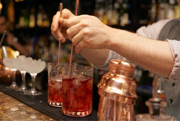 Bartender mixing drinks